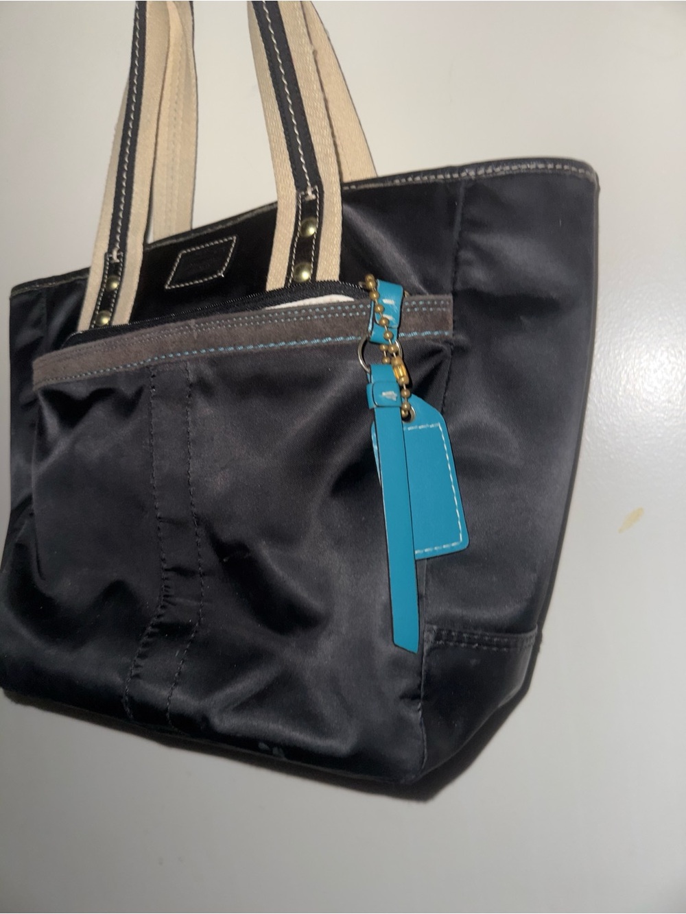 Coach Black Tote with Turquoise Tag and Beige Straps